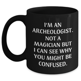 Archeologist Humor Black Coffee Mug, Funny Gifts from Friends, Unique Graduation Gifts for Her, Him, or Coworkers, 'I'm An Archeologist. Not A Magician...' - Main